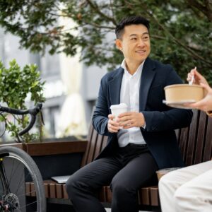 Business people having lunch at work in city
