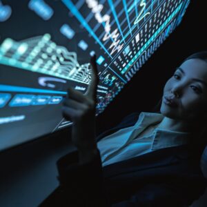 The business woman works with graphics on a sensor screen.